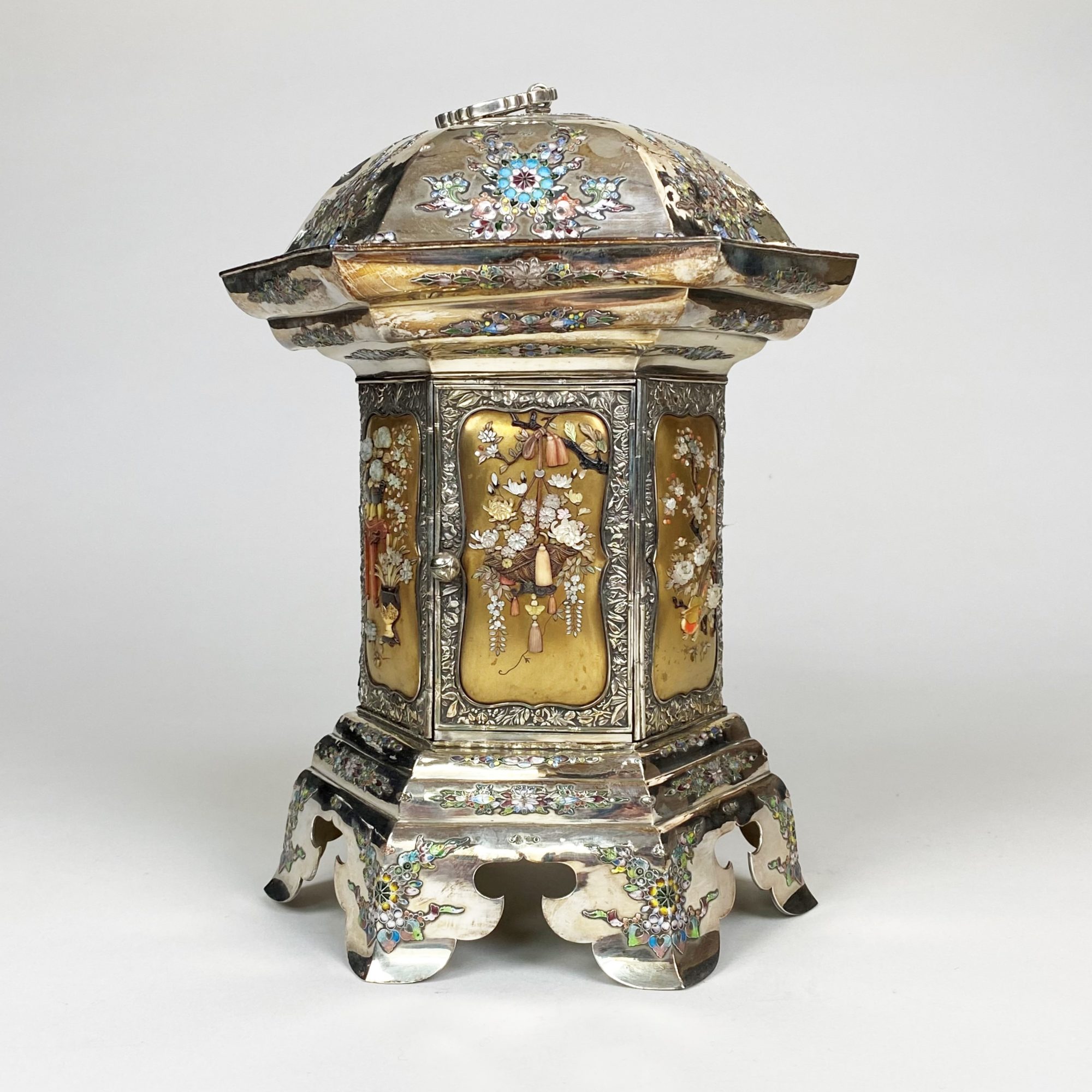 A Japanese Meiji-era (1868-1912) silver Kodansu in the form A Japanese Meiji-era (1868-1912) silver Kodansu in the form