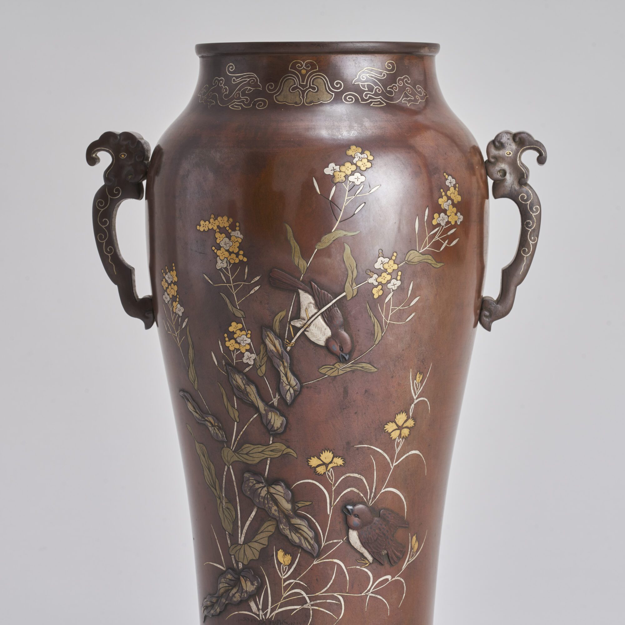 An attractive pair of late 19th Century inlaid and onlaid Bronze Japanese vases from Kevin Page