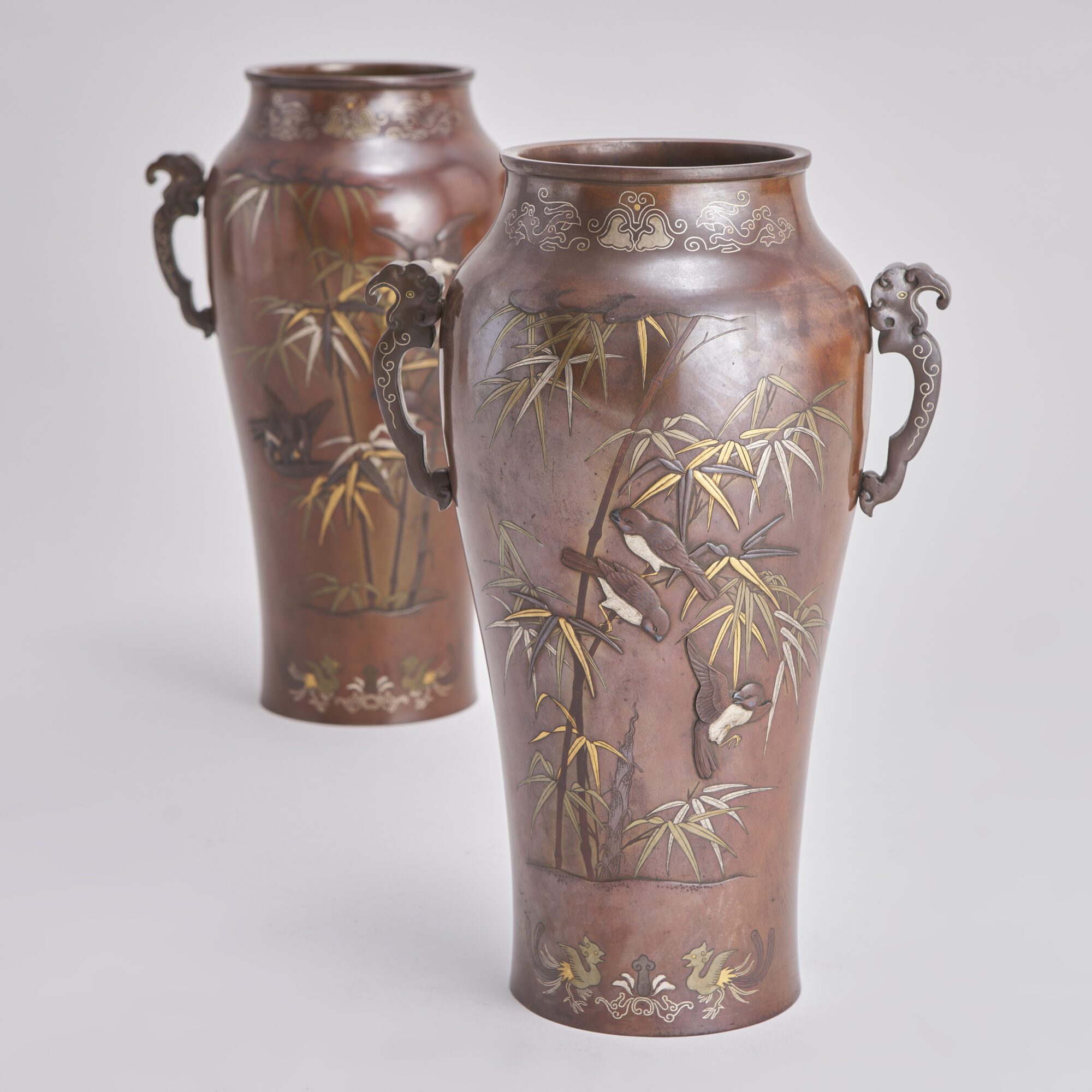 An attractive pair of late 19th Century inlaid and onlaid Bronze Japanese vases from Kevin Page